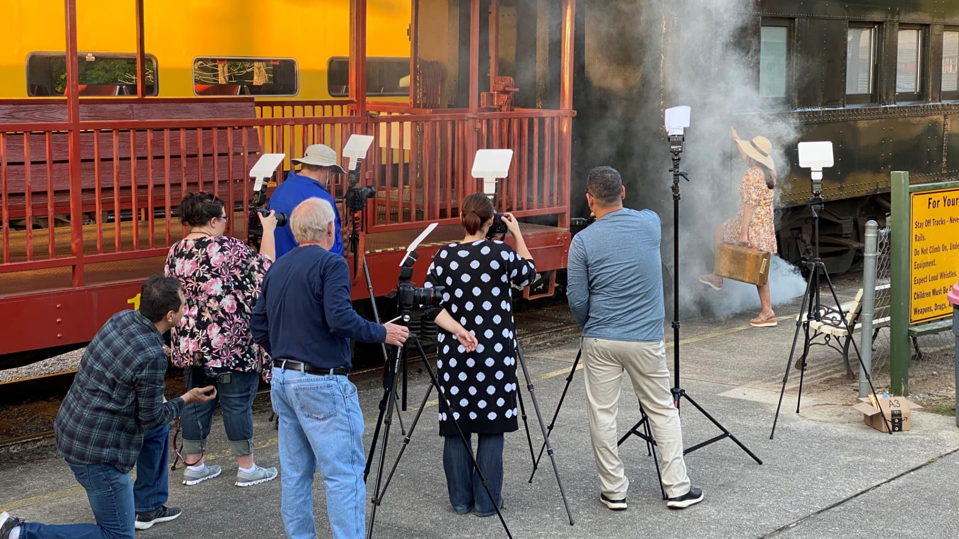 Photographers shooting a train