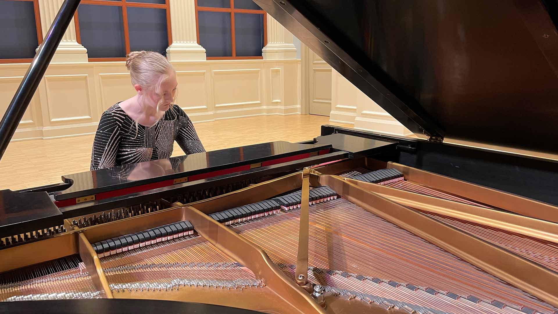 Young woman playing piano