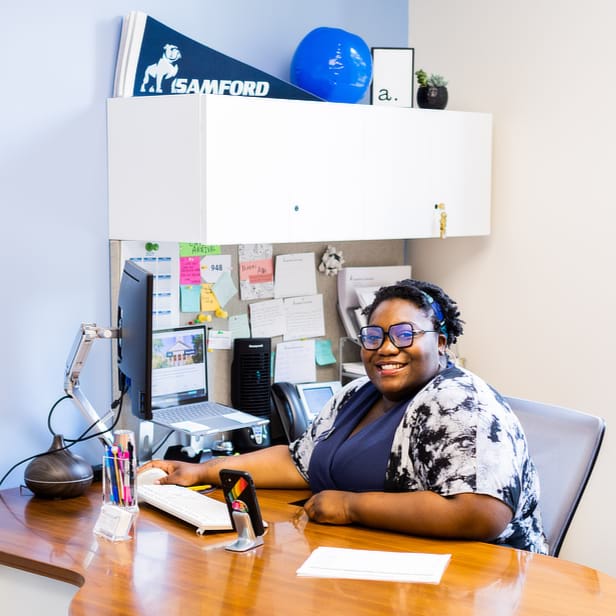 Admission Counselor at Her Desk