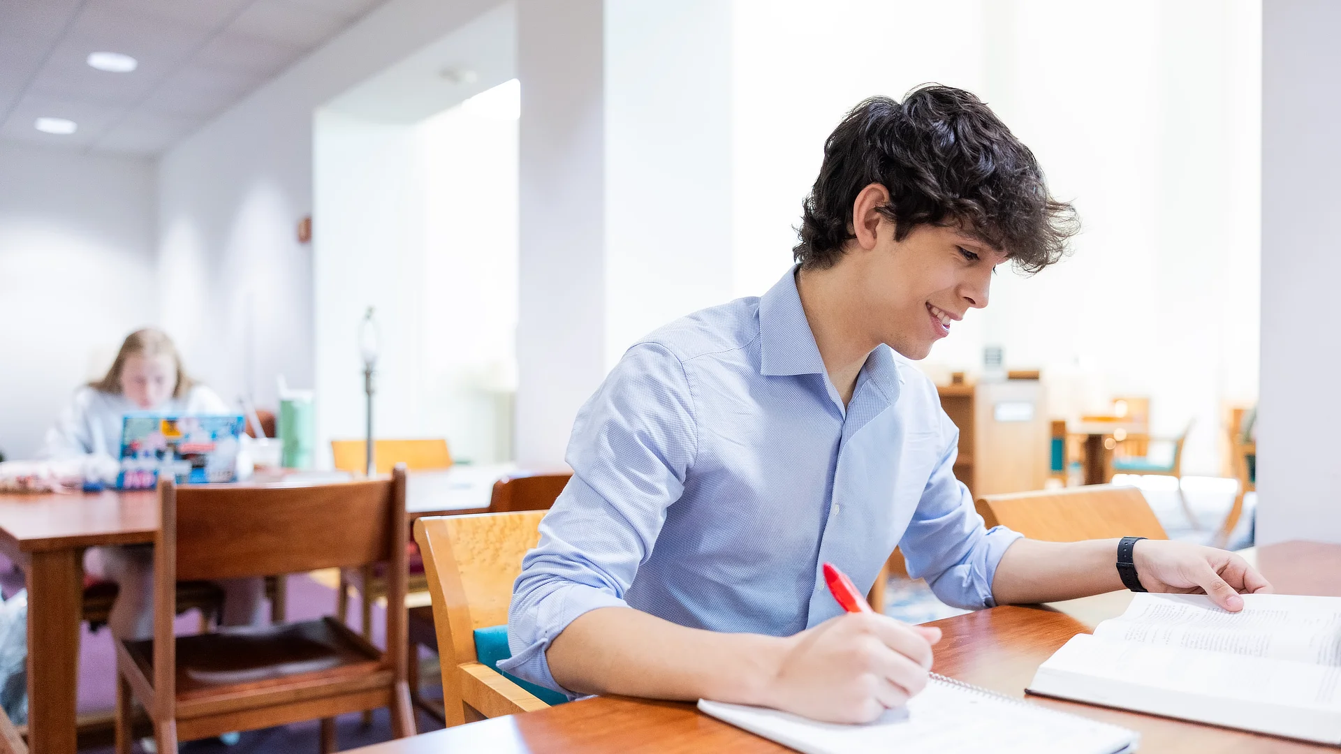 Male Student with Notebook