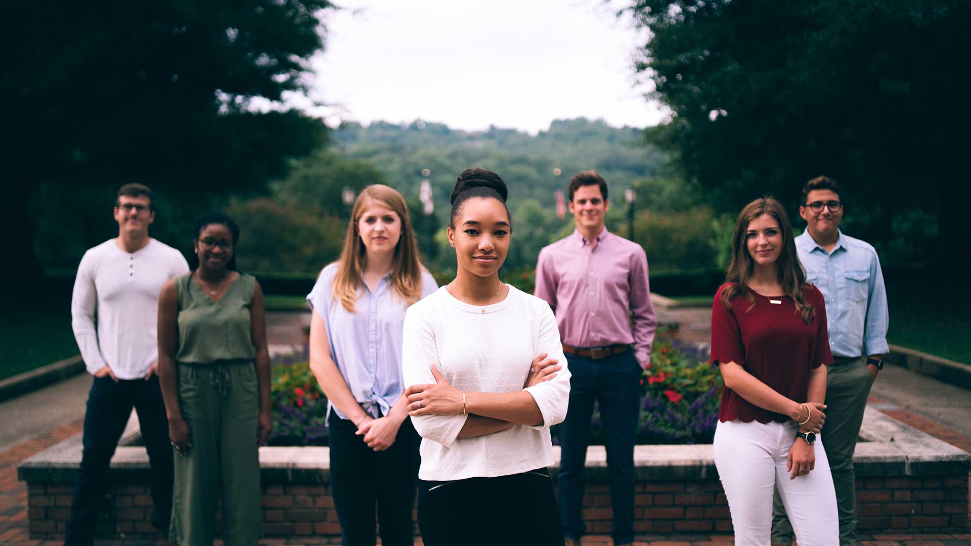 seven students posing on centennial walk