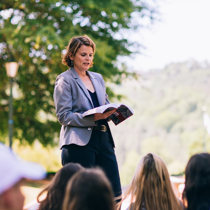 Female Professor Teaching Class Outside