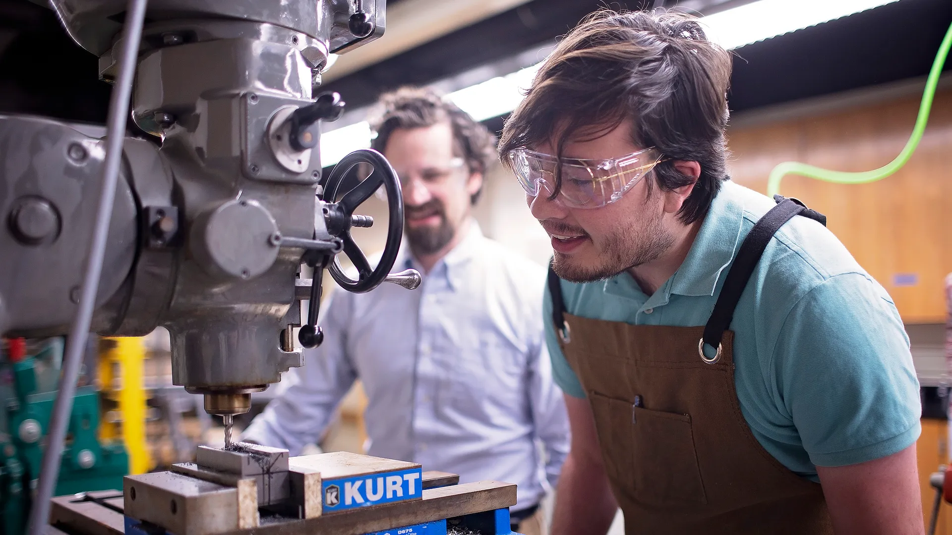 Engineering Student Working With Machine