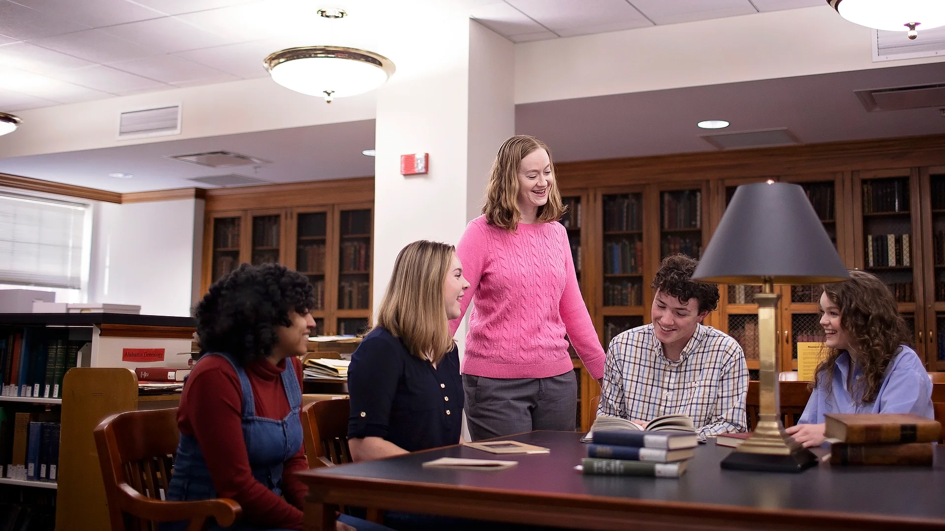 Female Professor Teaching Students At A Table DR03162023421