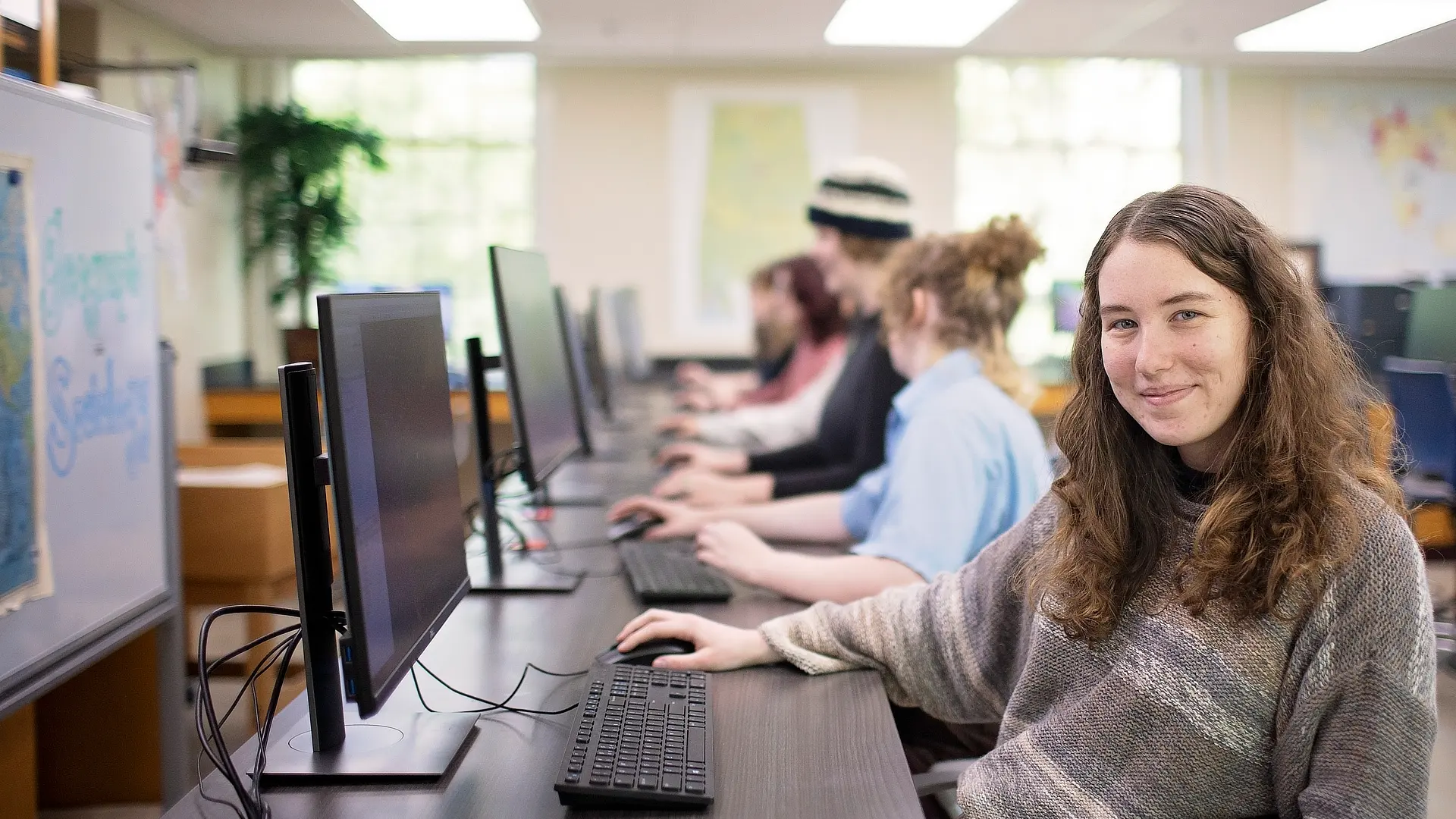 Female Student Working In Computer Lab