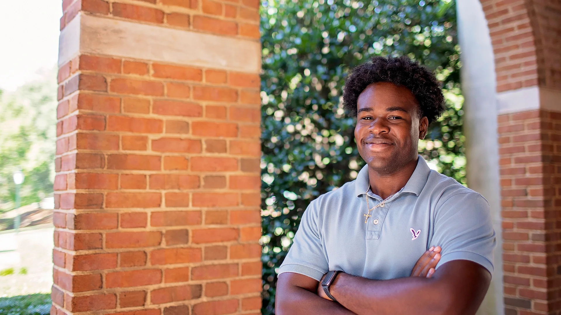 male student standing outside reid chapel