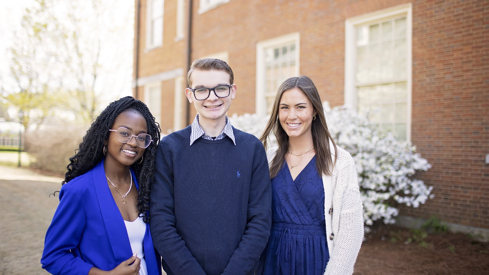 three smiling students DR03162023502