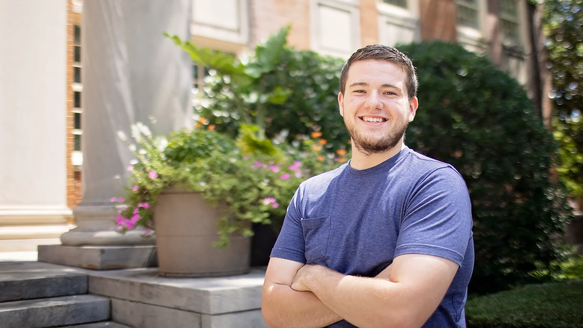 Male Student in Front of Library