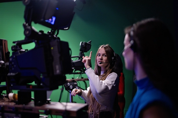 female student working the camera