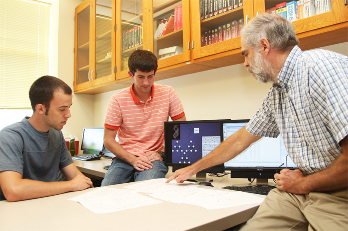 donaldson working with two students