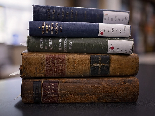 stack of books of Baptist history
