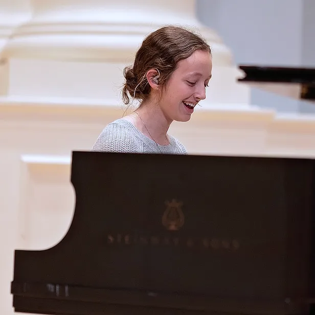 Female Student at Grand Piano