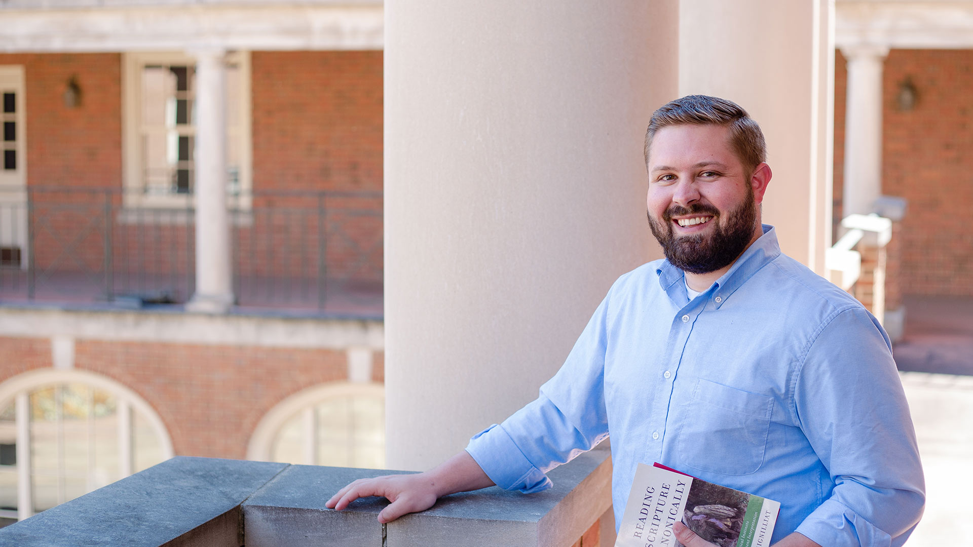 Beeson Student holding Book