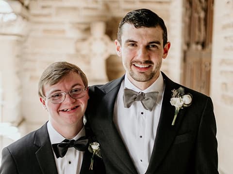 Two brothers in tuxedos