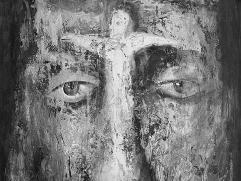 Monochrome painting of face and cross