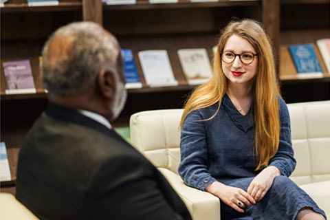 Robert Smith Jr Talking with Female Student