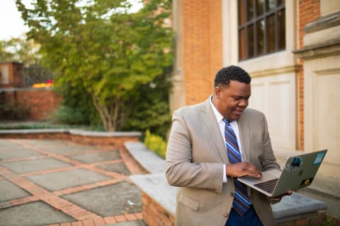 black male student with laptop SD1020693