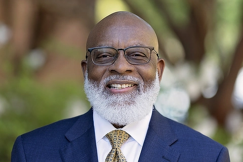 professor in a blue suit