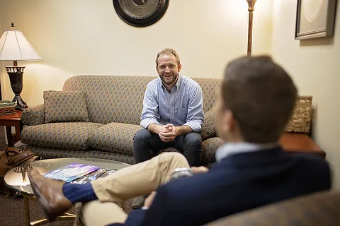 students sitting on a couch