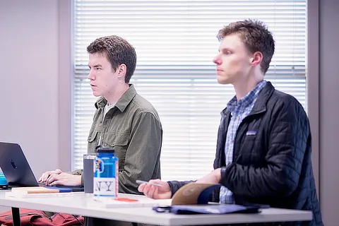 two divinity students in classroom