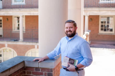 white male divinity student outside