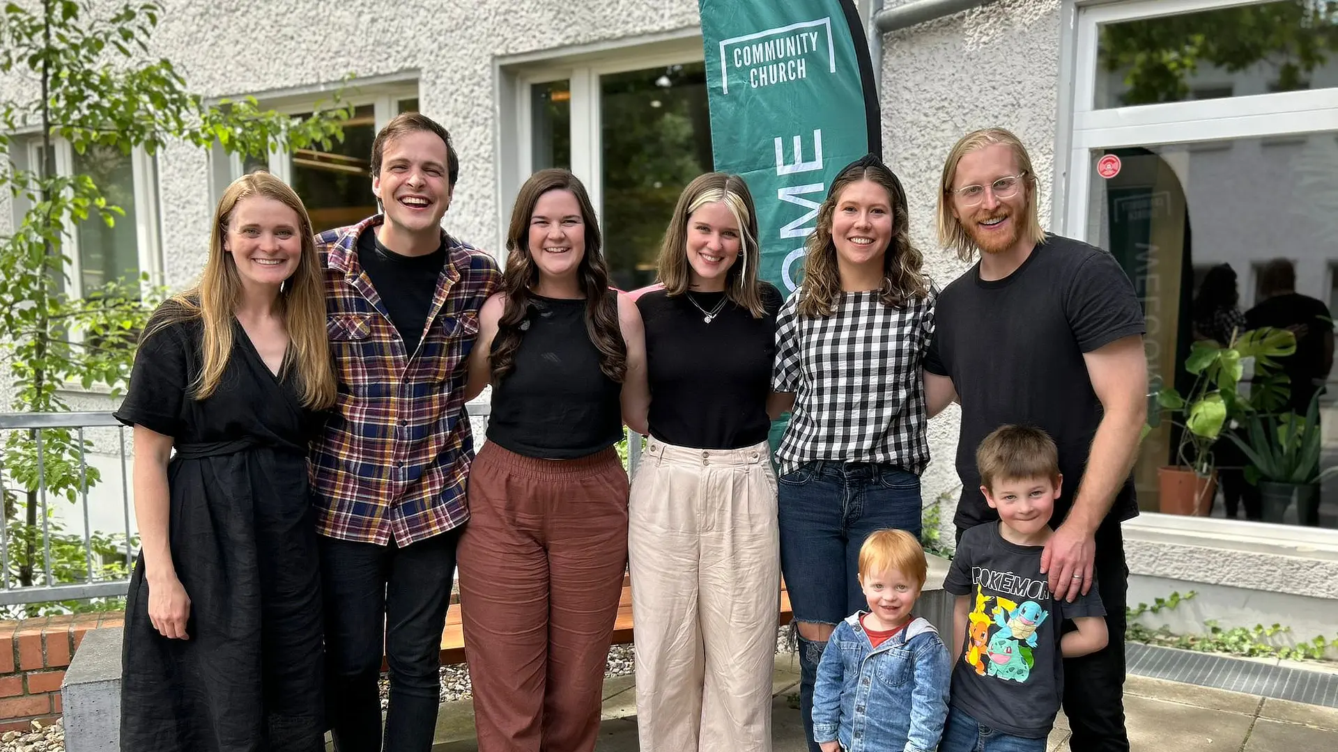 group of people outside of a church