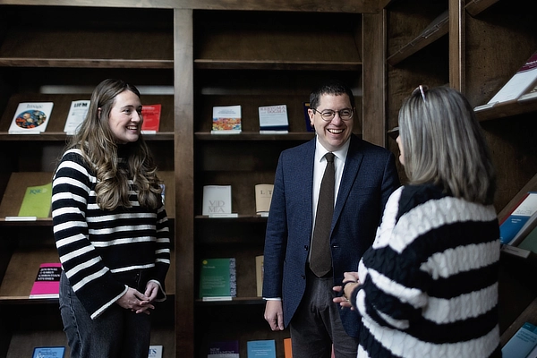 three mats students talking