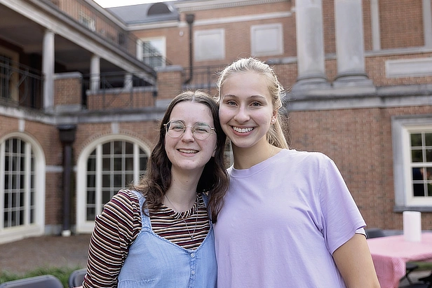 two female students in courtyard