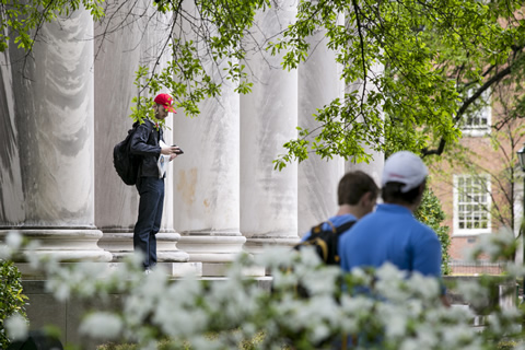 male student on library steps