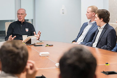 management students in meeting cta