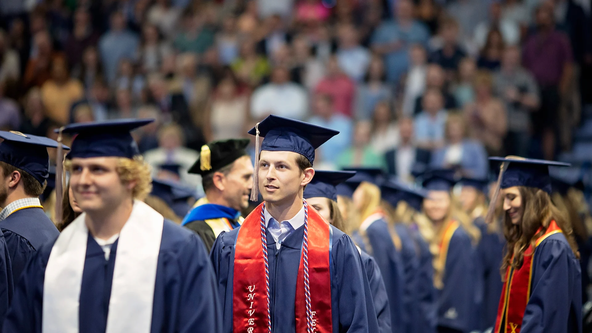 Business Students At Graduation Walking Up