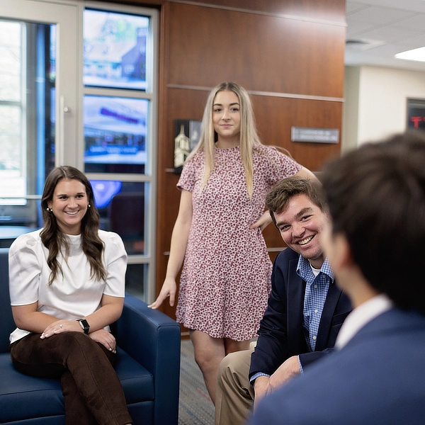 group of business students chatting