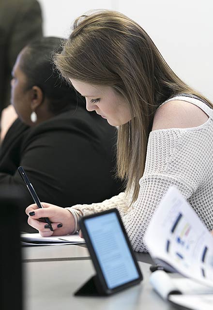 Students taking notes.