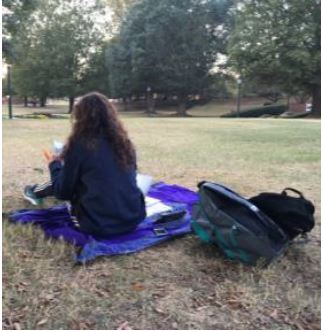 student-sitting-on-quad