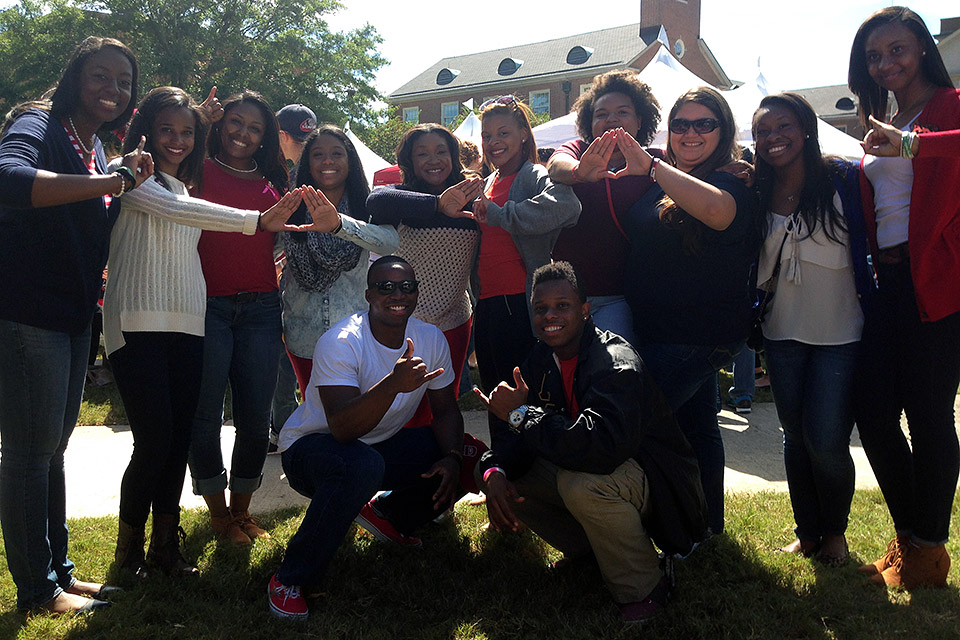 Diverse group of students posing together.