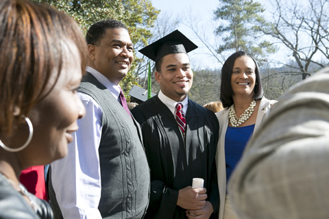 Male grad with his family