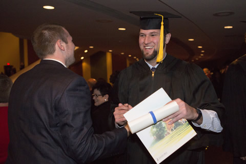 Male graduate in cap and gown