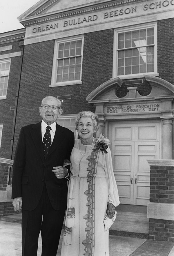 Mr and Mrs Beeson in front of the School of Education