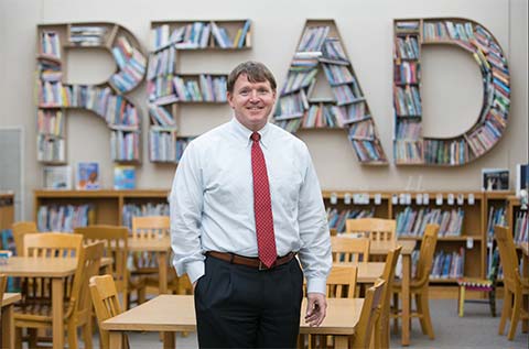 John Lowry in the school library