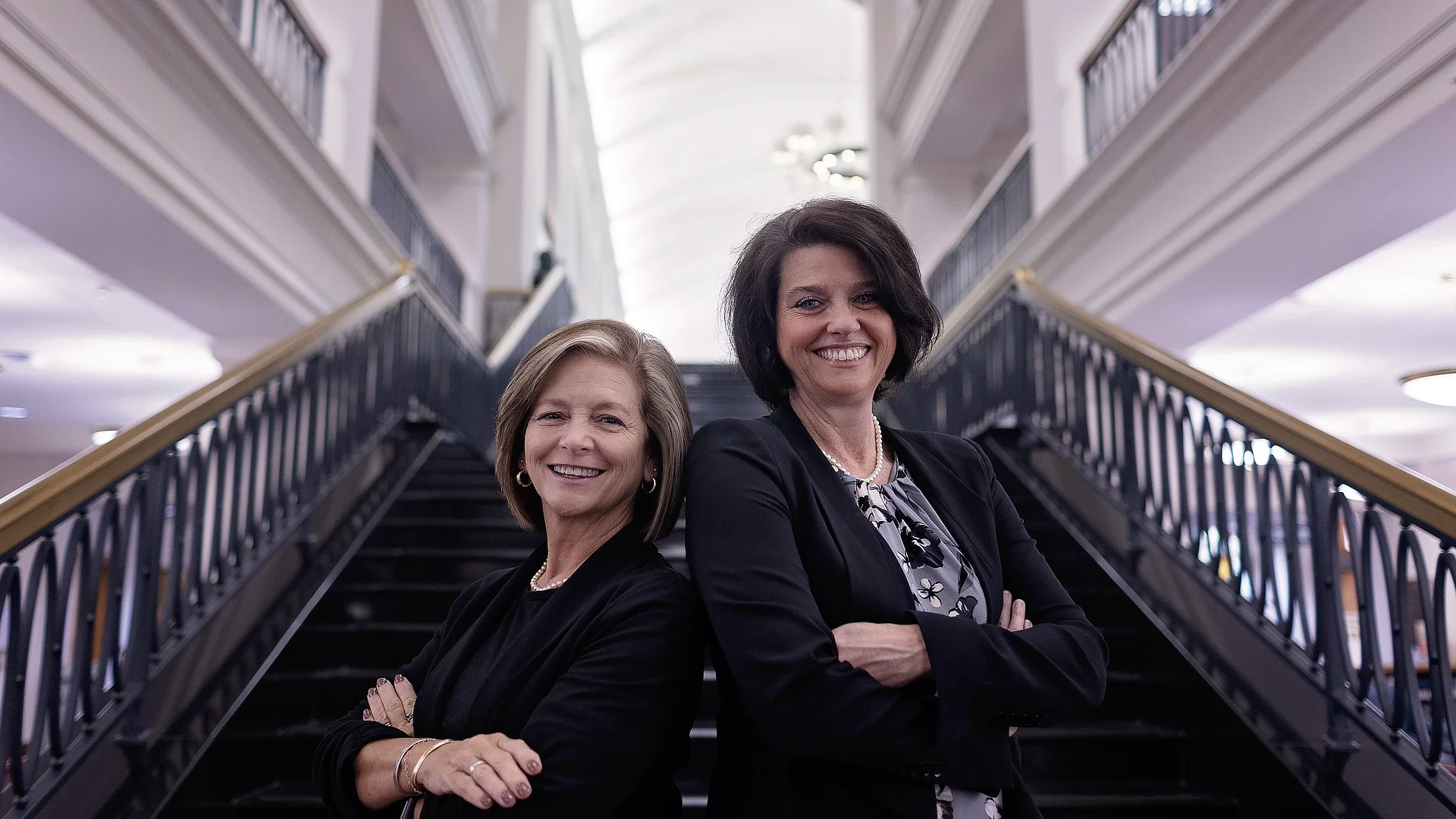 education faculty on library stairs