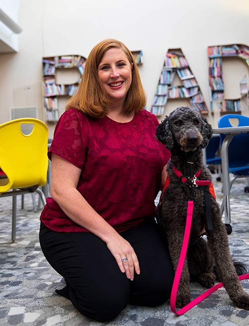 Dog and Teacher in Library