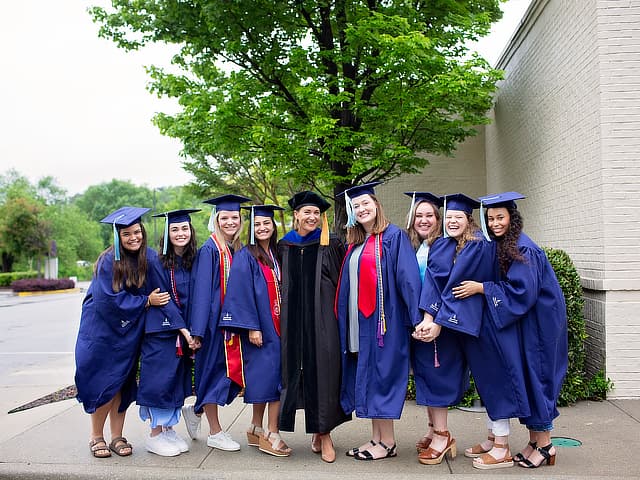 Secondary education students in graduation gowns
