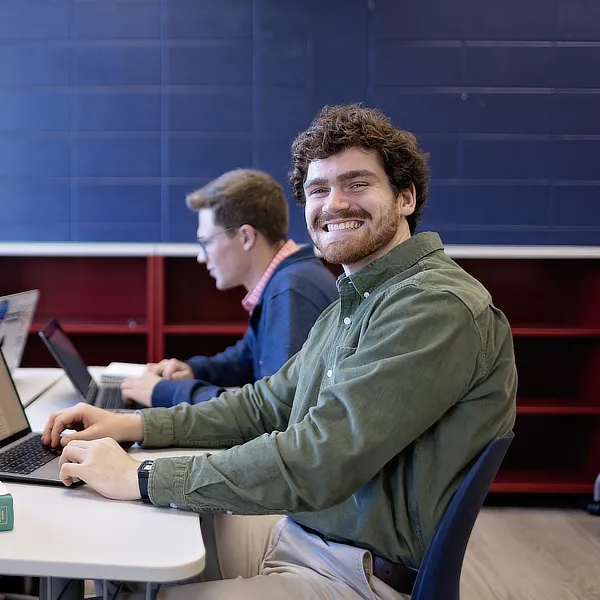 male student at a desk