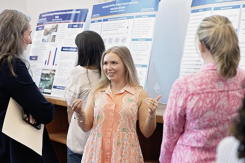 female student presenting research