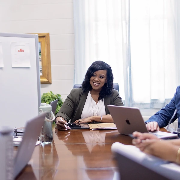 female teacher sitting at a table