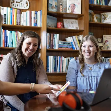 two female students laughing