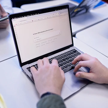 student working at a laptop