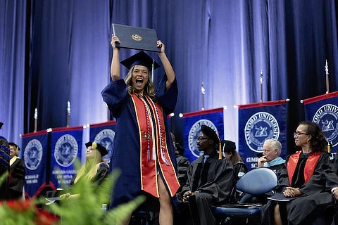 female student with diploma