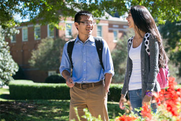 male and female minority students walking