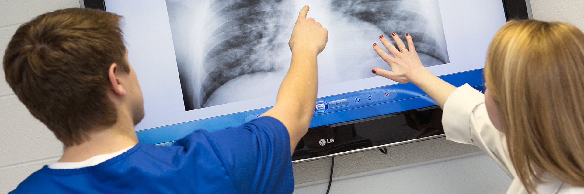 medical personnel examining lung xray